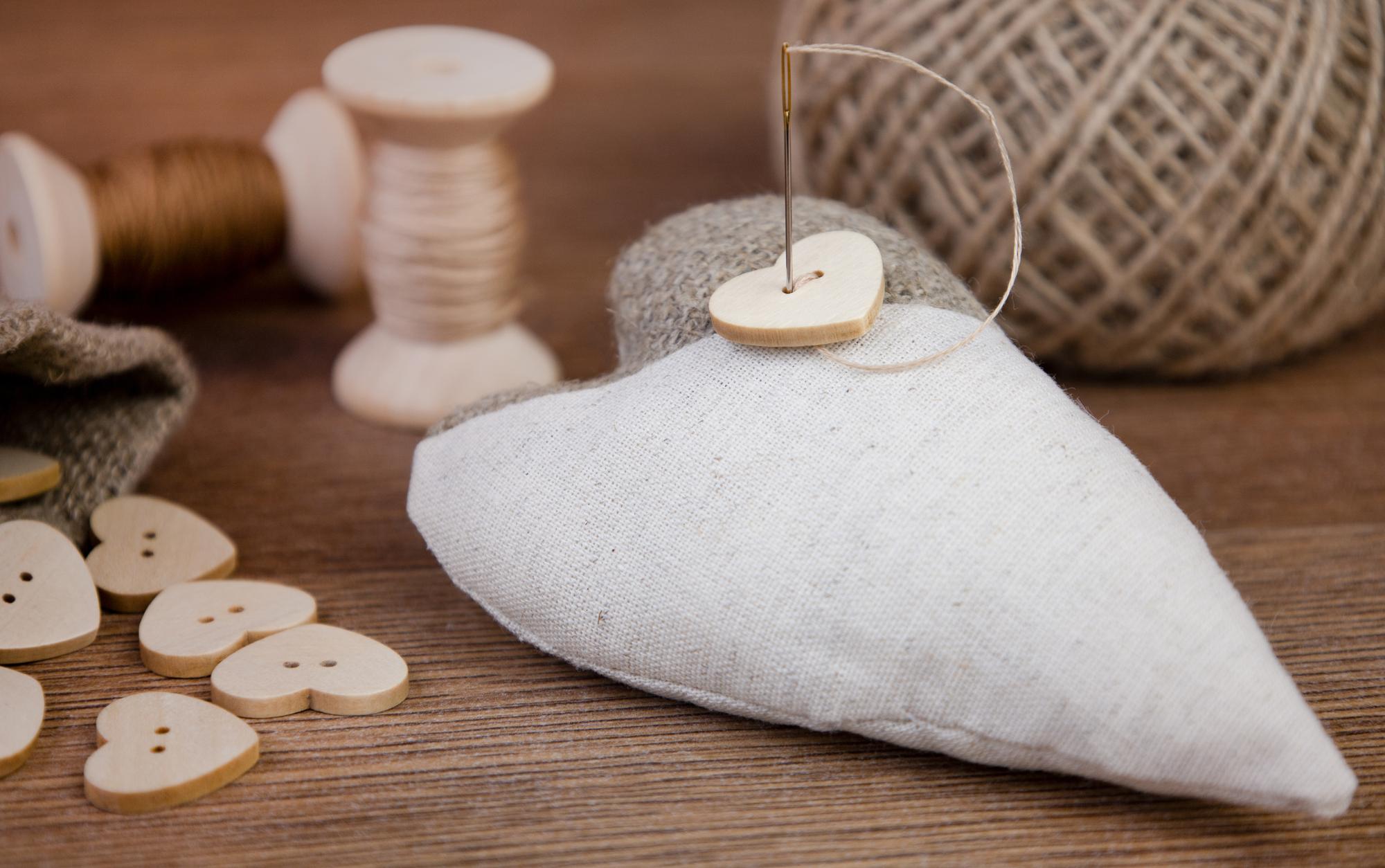 embroidered linen cushion with subtle tonal motif